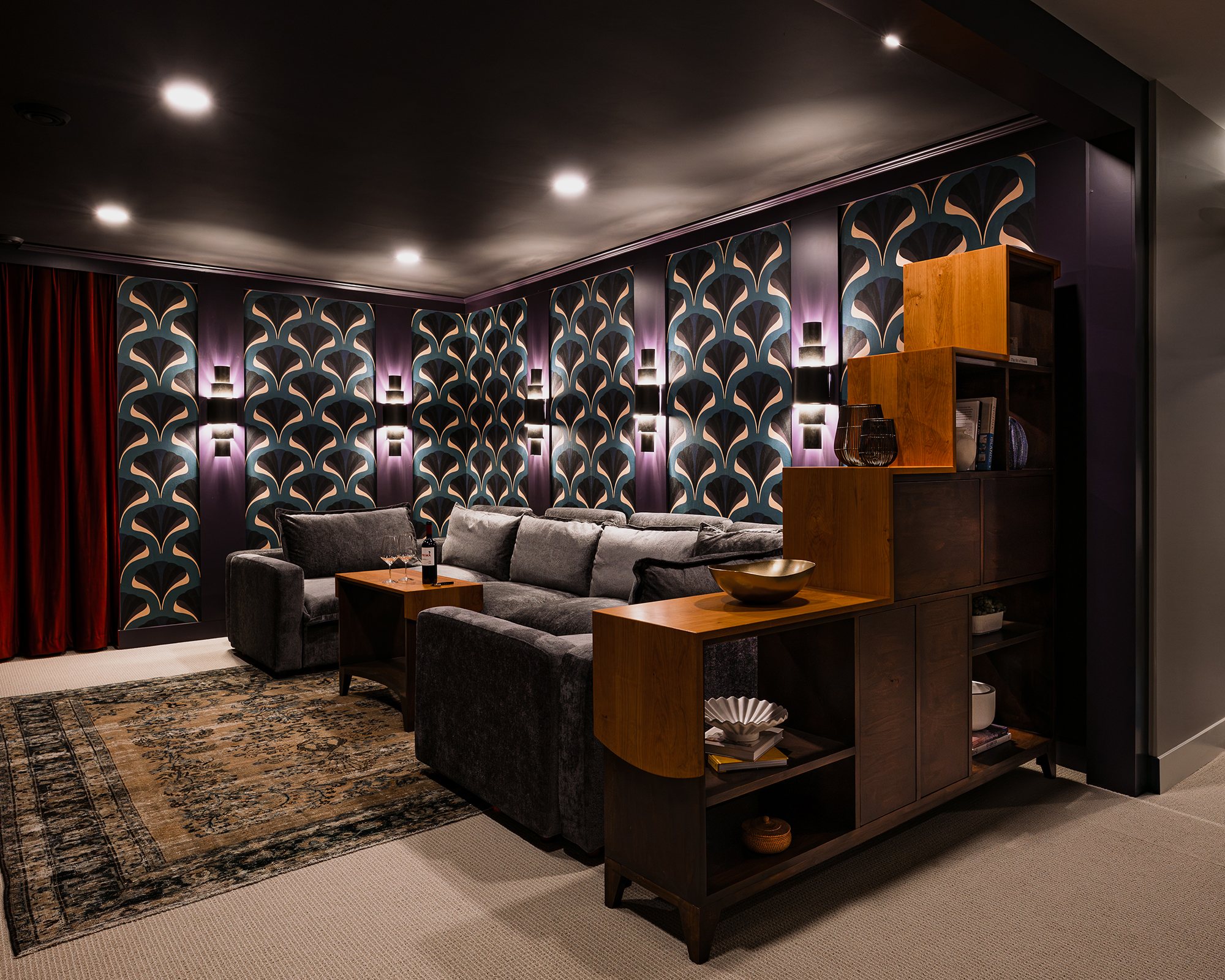 A waterfall edge hardwood bookcase with a matching side table in a living room